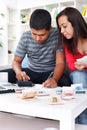Young couple calculating their expenses Royalty Free Stock Photo