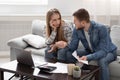 Young couple calculating their financial bills at home Royalty Free Stock Photo