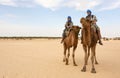 Young couple on camels