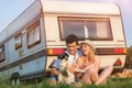 Young couple with a camper van