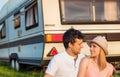 Young couple with a camper van