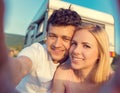 Young couple with a camper van