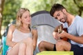 young couple camping playing guitar outdoor Royalty Free Stock Photo