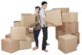 Young couple carrying boxes in studio Royalty Free Stock Photo