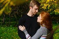 young couple are standing in an embrace in the park on a sunny day Royalty Free Stock Photo