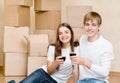 Young couple celebrating moving to new home Royalty Free Stock Photo