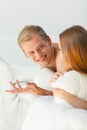 Young couple chatting in bed