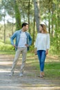 young couple chatting while walking along country path Royalty Free Stock Photo