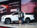 A young couple checks the specifications of a car Royalty Free Stock Photo