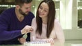 Young couple chooses engagement rings at the jewelry shop Royalty Free Stock Photo