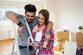 Young Couple Choosing Colors for Painting their Home Royalty Free Stock Photo