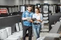 Couple choosing toilet ceramics in the shop Royalty Free Stock Photo