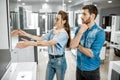 Couple chooosing new bathroom furniture in the shop Royalty Free Stock Photo