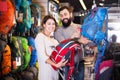 Couple choosing rucksack in store Royalty Free Stock Photo