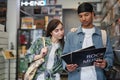 Young couple choosing vinyl records in record store Royalty Free Stock Photo