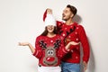 Young couple in Christmas sweaters