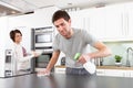 Young Couple Cleaning Modern Kitchen Royalty Free Stock Photo