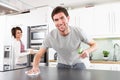 Young Couple Cleaning Modern Kitchen Royalty Free Stock Photo