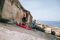 Young couple climbing rocks at the coast Royalty Free Stock Photo
