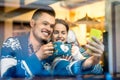 Young couple with coffee at the cafe in winter