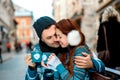 Young couple with coffee in winter outside