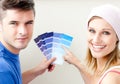 Young couple with color samples for painting room Royalty Free Stock Photo