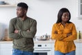 Young Couple Conflict. Offended Black Man And Woman Standing In Kitchen Royalty Free Stock Photo