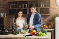 Young couple cooking healthy food together Royalty Free Stock Photo