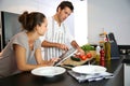 Young couple cooking in the kitchen Royalty Free Stock Photo