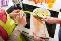 Young couple cooking together in kitchen