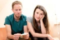 Young couple counting her money Royalty Free Stock Photo