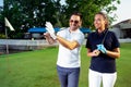 Couple at the course playing golf and looking happy Royalty Free Stock Photo