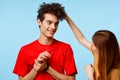 young couple cropped view studio blue background communication Royalty Free Stock Photo