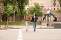 Young couple crossing street. Traffic rules and regulations Royalty Free Stock Photo