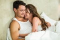 Young couple cuddling on bed Royalty Free Stock Photo