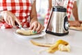 Young couple cutting banana at kitchen Royalty Free Stock Photo