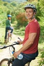 Young Couple Cycling Along Country Track Royalty Free Stock Photo