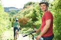 Young Couple Cycling Along Country Track Royalty Free Stock Photo