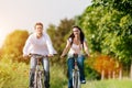 Young couple cycling with bicycle in summer Royalty Free Stock Photo