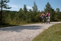 Young couple cycling with modern small e-bikes Royalty Free Stock Photo