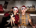 Young couple in 3D glasses watching movies at home at christmas Royalty Free Stock Photo