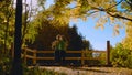 Young couple dancing on the bridge in the park Royalty Free Stock Photo