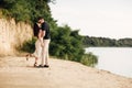 Young couple dancing and kissing at beach on sunny day Happy Romantic young Couple Enjoying Beautiful Sunset Walk on the Beach Royalty Free Stock Photo