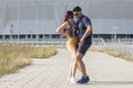 Young couple dancing Latino dance against urban landscape Royalty Free Stock Photo