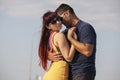 Young couple dancing Latino dance against urban landscape Royalty Free Stock Photo