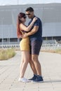 Young couple dancing Latino dance against urban landscape Royalty Free Stock Photo