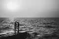 Young couple dancing at the pier at the beach summer time Royalty Free Stock Photo