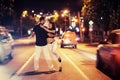 Young couple dancing on the road