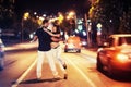 Young couple dancing on the road