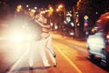 Young couple dancing on the road.